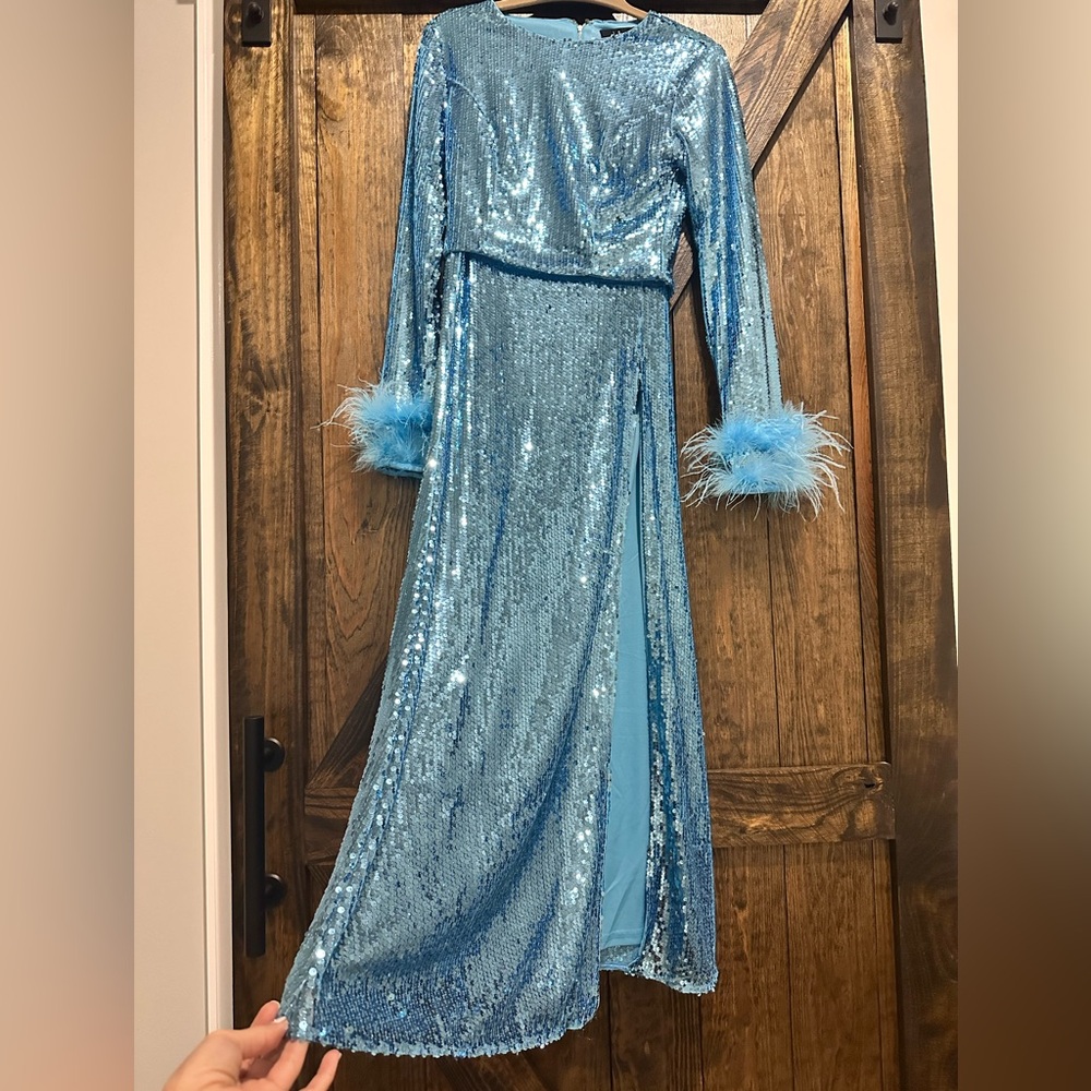XS blue sequin 2-piece. Top is long sleeve with fur cuffs Bottom has side split.